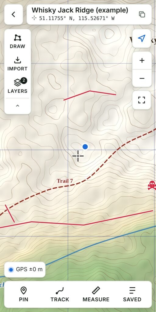 Outpost Maps showing a topographic map with GPS position, layers and a hazard symbol